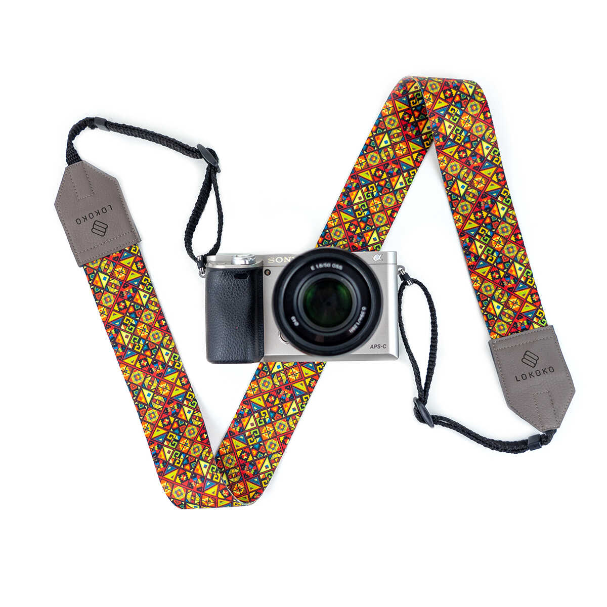 Popruh na fotoaparát Rebus